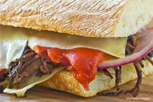 Post image for Red Wine-Braised Flank Steak with Roasted Peppers, Onions & Gruyere Panini